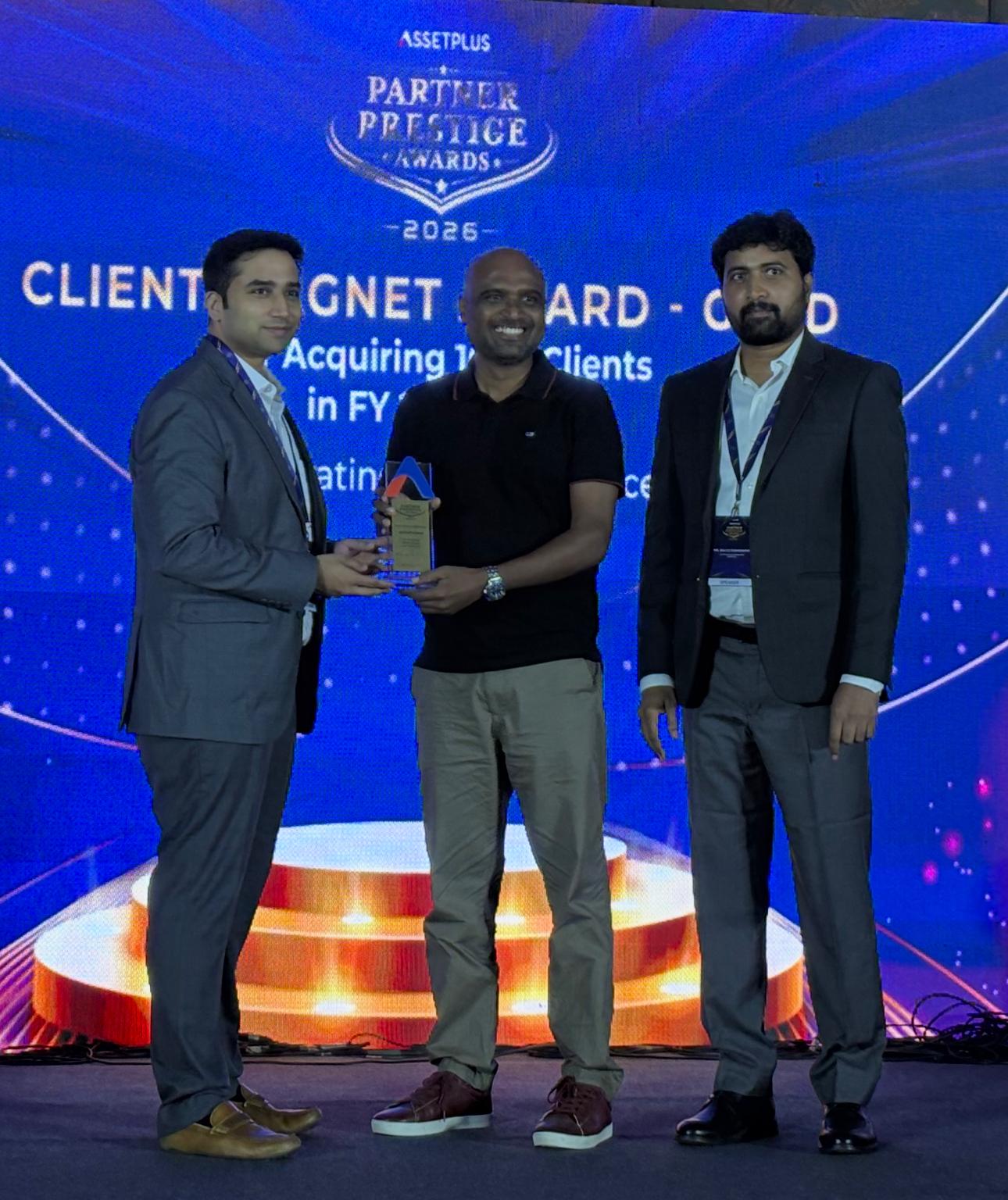Sathish receiving the AssetPlus award on stage